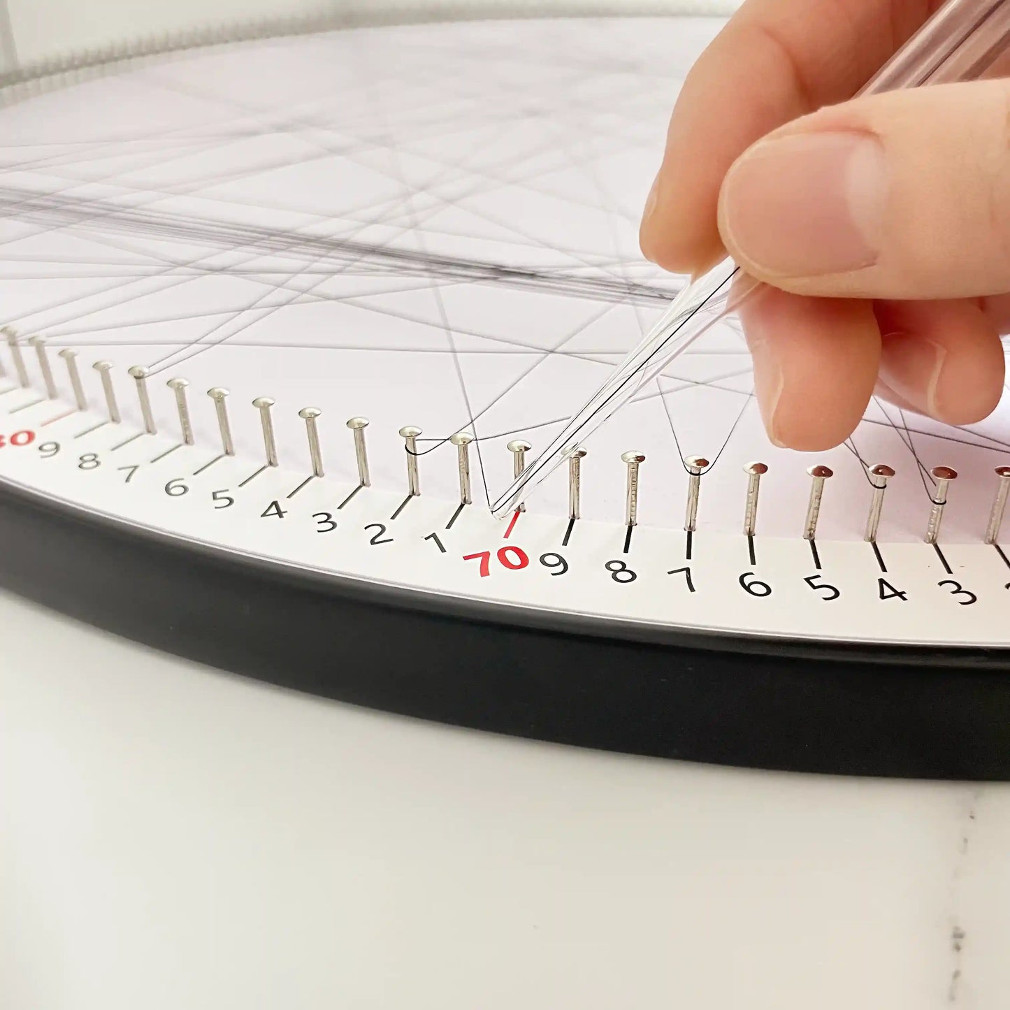 Detailed view of the custom black string art creation process using the DIY Kit from the Customization Collection