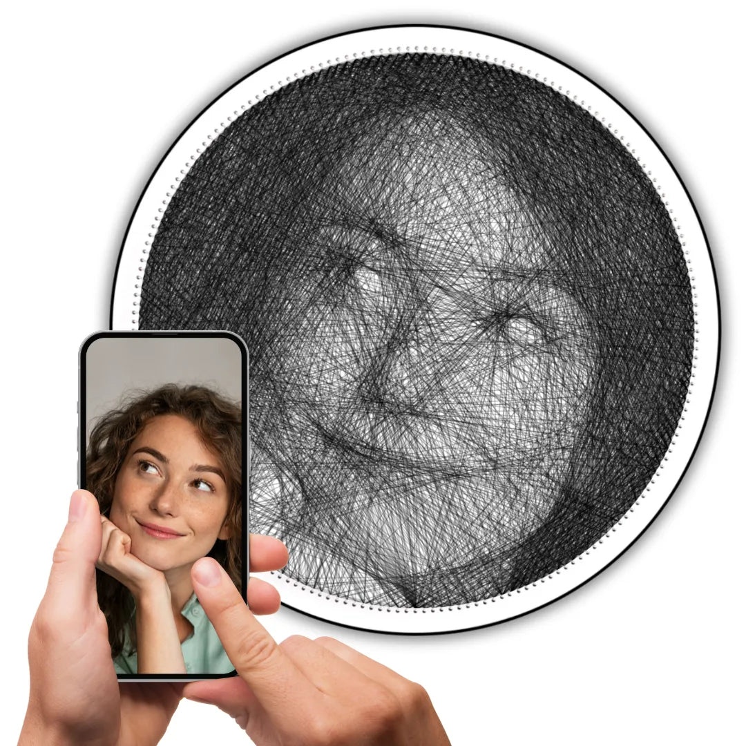 Custom black string art of a girl’s selfie on white board with black string, original image shown on a phone held in hand