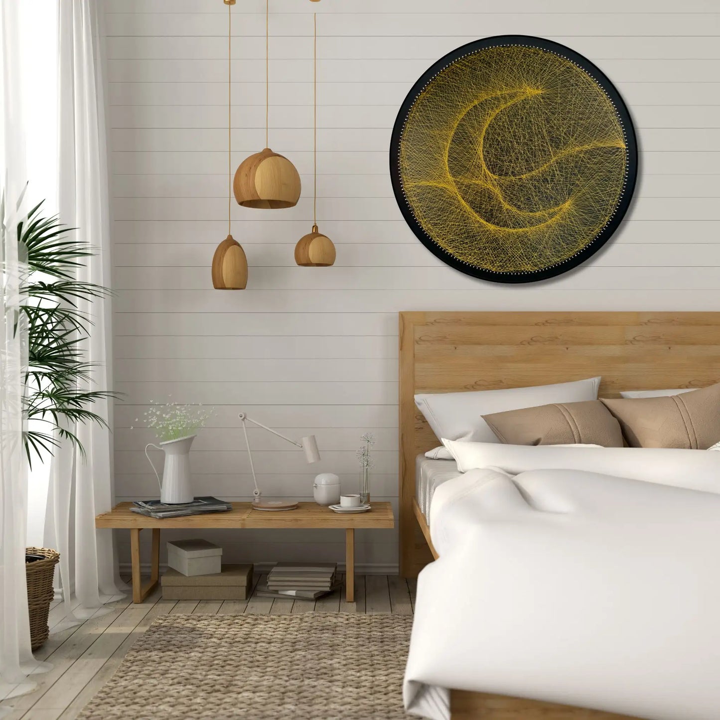 Finished string art design of a moon from the Gold Collection displayed in an interior setting