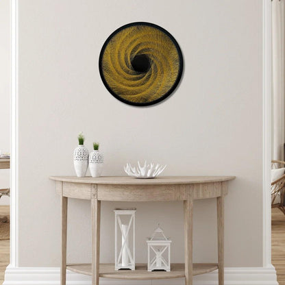 Finished string art design of a spiral pattern from the Gold Collection displayed in an interior setting