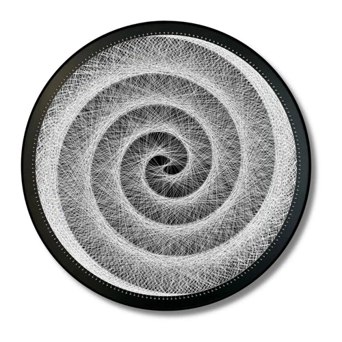 Finished string art design of Hypnotic Swirl from the White Collection using black board and white strings
