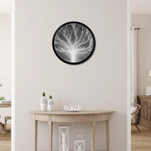 Finished string art design of a branch from the White Collection displayed in an interior setting