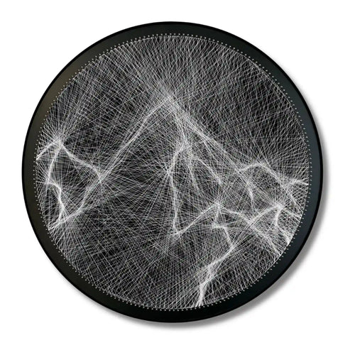 Finished string art design of mountain from the White Collection using black board and white strings